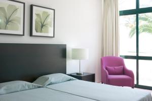 Postel nebo postele na pokoji v ubytování Hotel Torre Praia