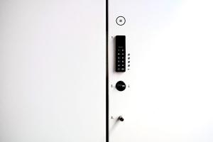 a close up of a door with a remote control at SLEEEP HKG Gough St in Hong Kong