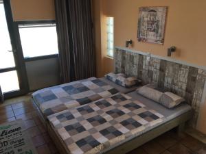 Ένα ή περισσότερα κρεβάτια σε δωμάτιο στο Anissaras Beach Appartement +18 φωτογραφίες