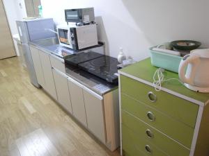A kitchen or kitchenette at 宿家STARY越中 izumicho