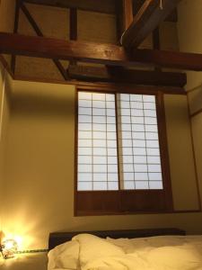 A bed or beds in a room at 宿家STARY越中 izumicho