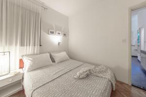 Postel nebo postele na pokoji v ubytování Apartments Lodra