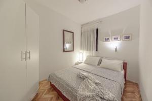 Postel nebo postele na pokoji v ubytování Apartments Lodra