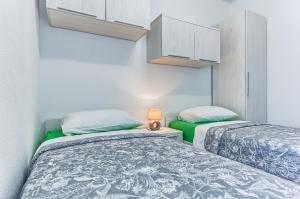 Posteľ alebo postele v izbe v ubytovaní Apartments & Bungalows Ivanović