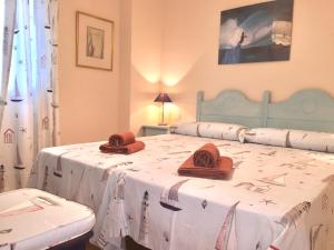 Postel nebo postele na pokoji v ubytování Apartamentos San Bruno Canela