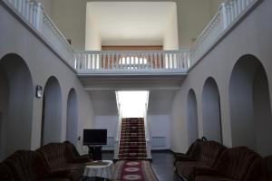 a hallway with couches and a staircase in a building at Health Resort Arzni 1 in Arzni