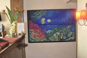 a painting of an aquarium on a wall at Amico Hotel in Rome