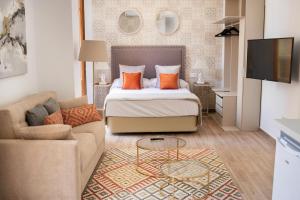 Postel nebo postele na pokoji v ubytování Feelathome Mártires Apartments