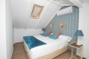Posteľ alebo postele v izbe v ubytovaní Feelathome Mártires Apartments