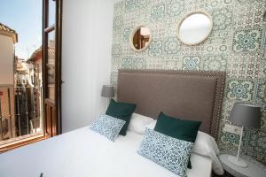 Posteľ alebo postele v izbe v ubytovaní Feelathome Mártires Apartments