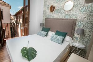 Posteľ alebo postele v izbe v ubytovaní Feelathome Mártires Apartments