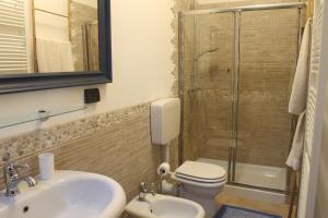 a bathroom with a sink and a toilet and a shower at B&B Polirone in San Benedetto Po +26 photos