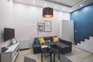 Televízia a/alebo spoločenská miestnosť v ubytovaní CYC Apartment