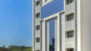 a rendering of a building with glass windows at Hotel Southern Grand in Vijayawāda