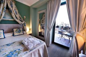 Voodi või voodid majutusasutuse OSTUNI PALACE - Hotel Bistrot & SPA toas