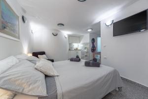 Postel nebo postele na pokoji v ubytování Apartments Lodra