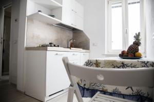 Kuchyň nebo kuchyňský kout v ubytování Tre Archi Apartment & Relais