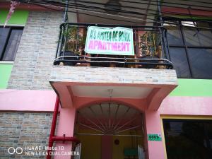 un cartello sul lato di un edificio di A's Azotea de Bohol a Città di Tagbilaran