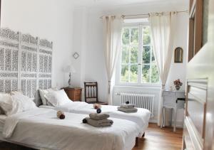 Postel nebo postele na pokoji v ubytování La Maison des Fontaines d'Alsace