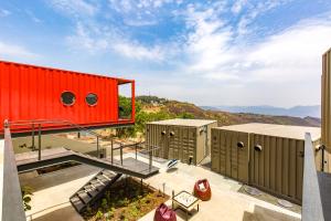 a view from the roof of a building with a red container at Zostel Plus Panchgani in Panchgani