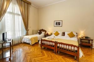 Un pat sau paturi într-o cameră la Hotel Villa Maria