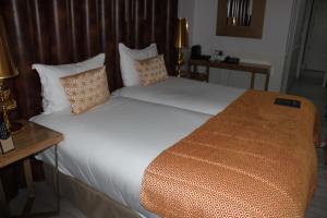 Cama ou camas em um quarto em Hotel Art Santander