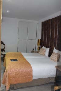 Cama ou camas em um quarto em Hotel Art Santander