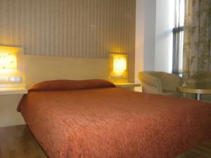 Giường trong phòng chung tại Valcarce Ferrol
