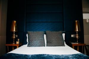 Cama ou camas em um quarto em Hotel Art Santander