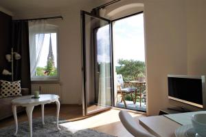 a living room with a view of the eiffel tower at Meissen Apartments - moderne Ferienwohnungen in Meißen am Lutherplatz in Meißen
