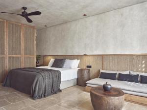 A bed or beds in a room at Olea All Suite Hotel, a Member of Design Hotels