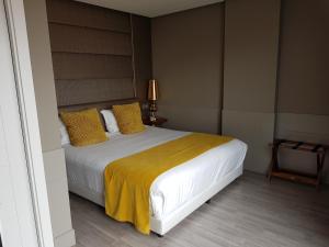 Cama ou camas em um quarto em Hotel Art Santander