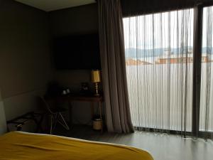 Cama ou camas em um quarto em Hotel Art Santander