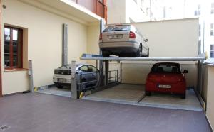 a garage with two cars sitting on top of it at EA Hotel Downtown in Prague