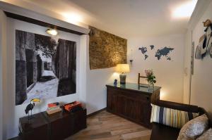 a living room with a large picture on the wall at B&B Il Lentisco in Camerota