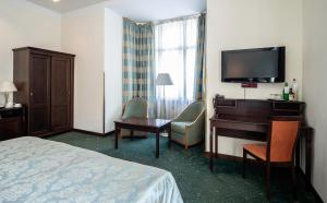 Posteľ alebo postele v izbe v ubytovaní EA Hotel Downtown