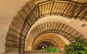 a spiral staircase in a building at EA Hotel Sonata in Prague