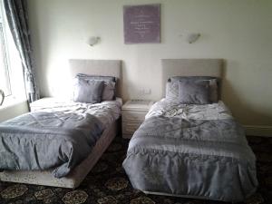 Postel nebo postele na pokoji v ubytování Le Maitre