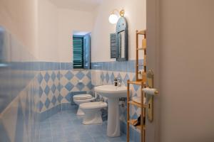 Koupelna v ubytování Al teatro Massimo + 32 fotografií