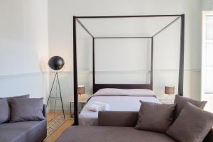 Postel nebo postele na pokoji v ubytování Al teatro Massimo