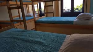 a bed room with two bunk beds and a window at CoolHostel in Porto