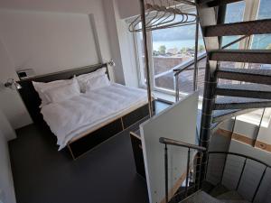 Postel nebo postele na pokoji v ubytování lofthotel Walensee + 25 fotografií