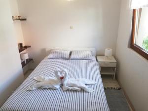 Кровать или кровати в номере Nautica Apartments