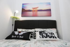 A bed or beds in a room at Apartamento Playa Las Canteras