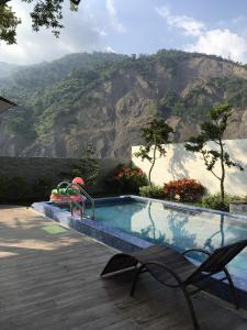 a swimming pool with a view of a mountain at Shanze Bora villa in Liugui
