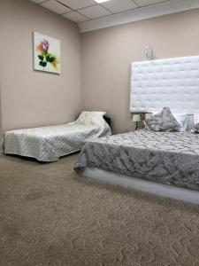  Кровать или кровати в номере Бутик Отель Дворянское Гнездо 