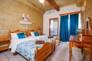 Krevet ili kreveti u jedinici u objektu Bellavista Farmhouses Gozo