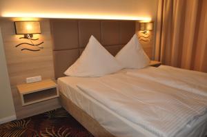 Krevet ili kreveti u jedinici u okviru objekta Avalon Hotel Bellevue