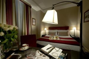 Postel nebo postele na pokoji v ubytování Hotel dei Borgognoni