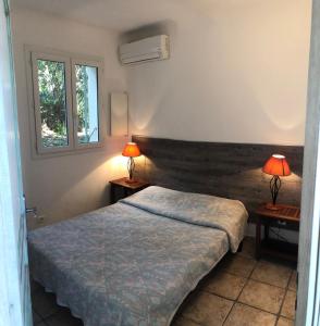 Postel nebo postele na pokoji v ubytování Residence ISULA DI I CORSI